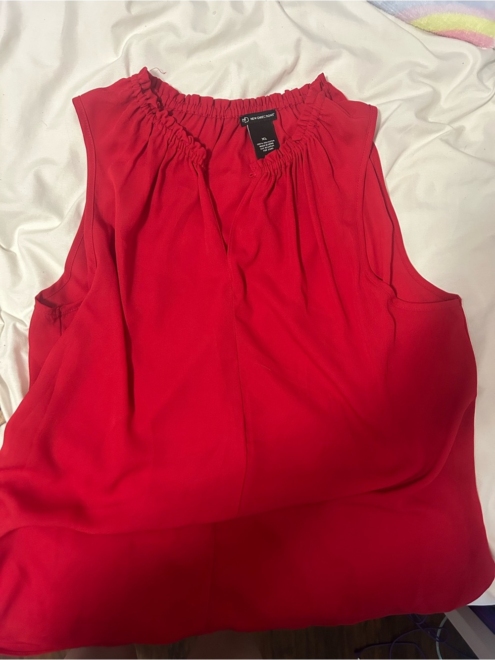 Sleeveless red blouse